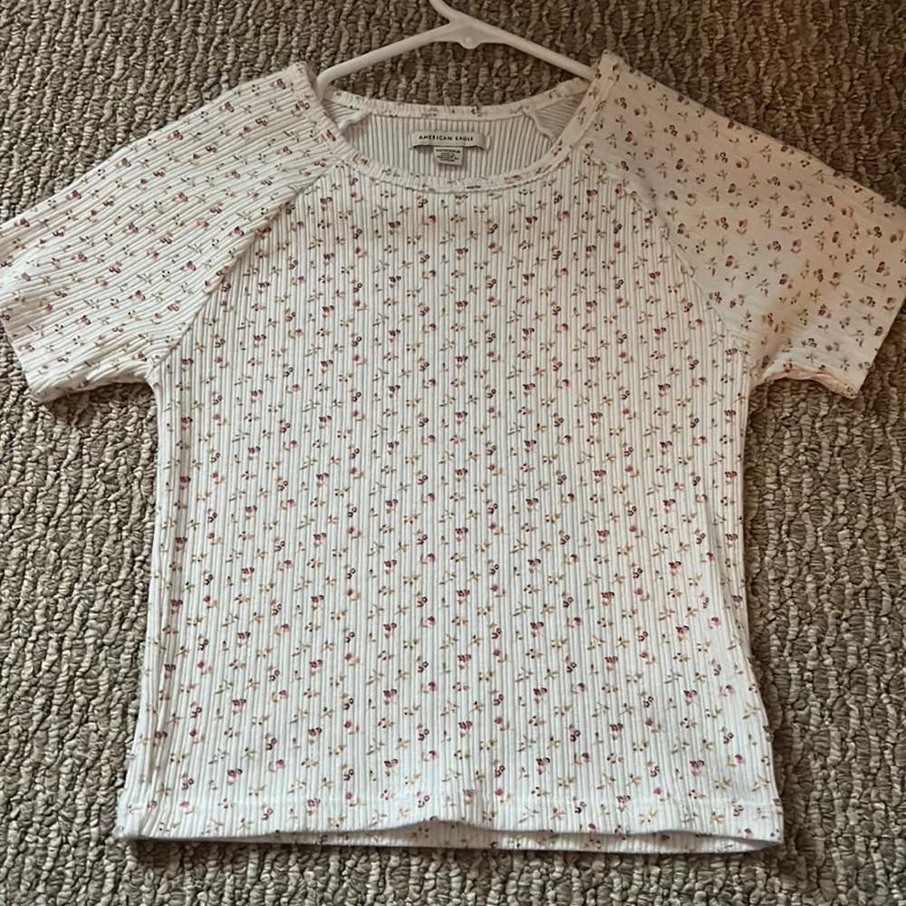 White floral American Eagle tee.